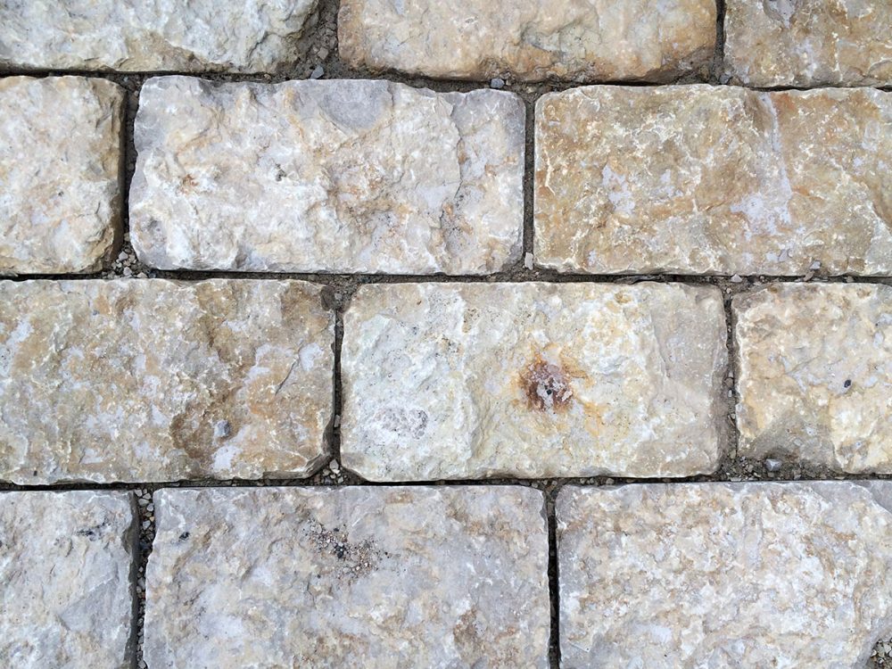 Rustic gold 5x10 tumbled pavers close-up
